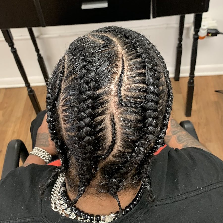 Photo from Lyn African Hair Braiding's own Google Business Profile: feed-in cornrows braided straight back, seen from above.